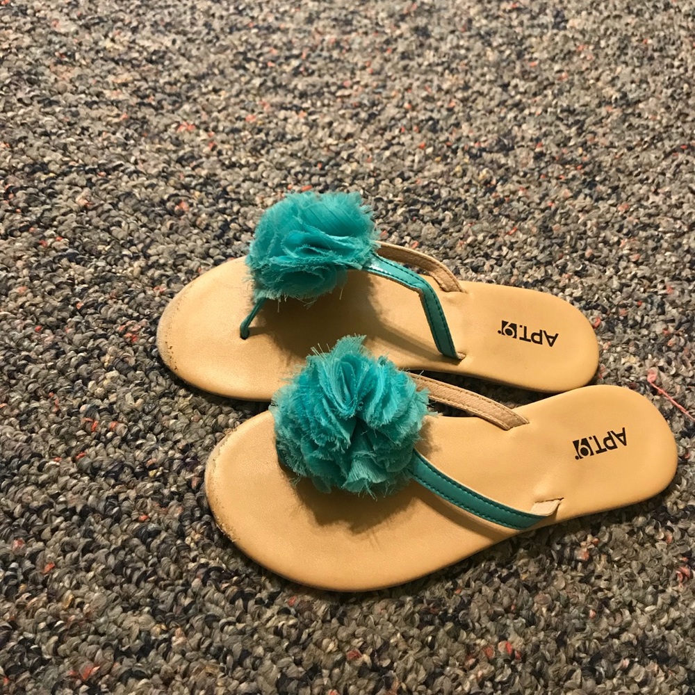 Blue poof flip flops